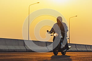 Young man riding big bike motocycle on asphalt high way against, Motorbike man has freedom