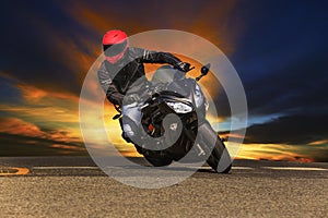Young man riding big bike motorcycle on asphalt roads