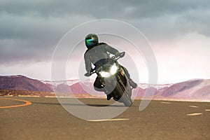 young man riding big motorcycle on asphalt highway ,use for people leisure traveling and adventure lifestyle
