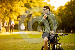 Young man riding ebike in the park