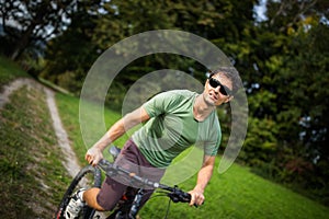 Young man riding his mountain bike outdoors