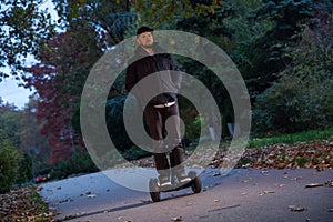 Young man riding hoverboard
