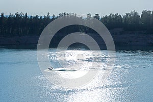 Young man riding a hydrocycle in the sea or lake