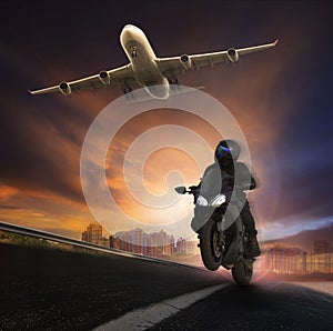 Young man riding motorcycle on asphalt highways road with high s