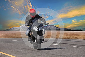 young man riding motorcycle in asphalt road curve use for extreme sport leisure