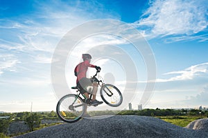 Young man riding mountain bike, Young bright man on mountain bike