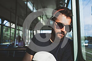 Young man riding in public transport