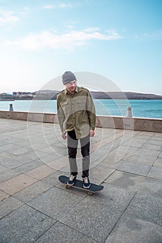 Young man riding a skateboard making tricks and jumps