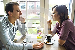 Young man on romantic date with his sweetheart in cafe