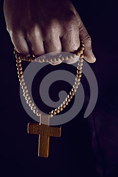 Young man with a rosary in his hand