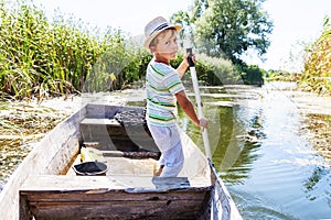 Young man rowing a boat