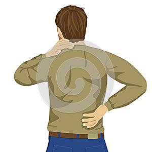 Young man rubbing his painful back. Pain relief, chiropractic concept