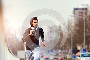 A young man running on the bridge