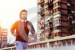 A young man running on the bridge