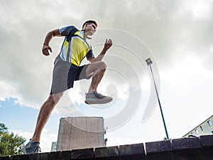 Young man running in park