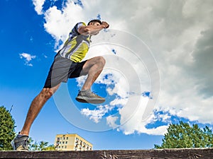Young man running in park