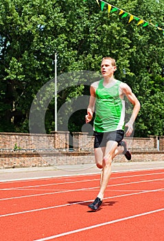 Young Man Running on Track