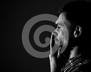 Young man, sad emotions, black and white photography