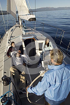 Young man sailing boat