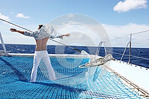 Young man sailing his boat on the open ocean