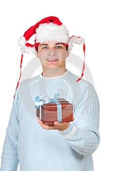 Young man in santa's hat holding present box