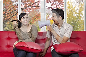 Young man scolding his girlfriend