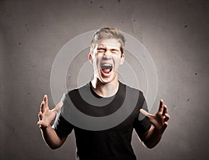 Young man screaming