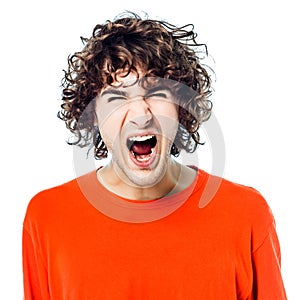 Young man screaming angry portrait