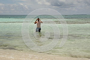 Young man in the sea photo