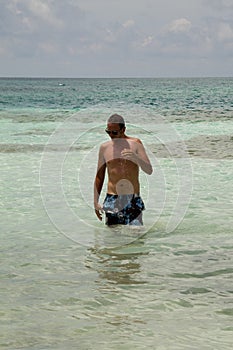 Young man in the sea photo
