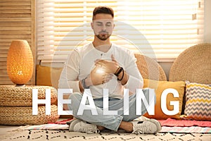 Young man during self-healing session in therapy room