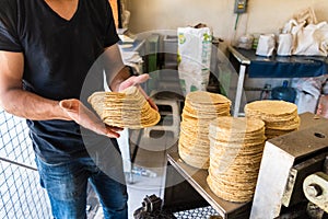 Young man selling tortillas of nixtamal