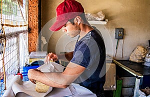 Young man selling tortillas of nixtamal