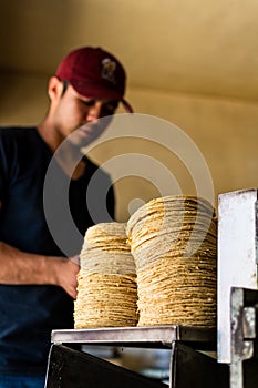 Young man selling tortillas of nixtamal