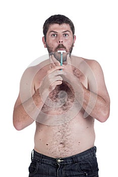 Young man shaving his face