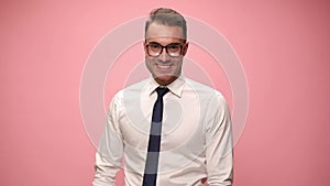 young man in shirt and tie on pink background