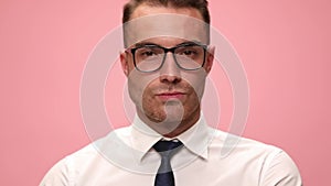 young man in shirt and tie on pink background