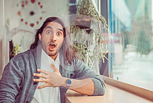 Young man with shocked facial expression