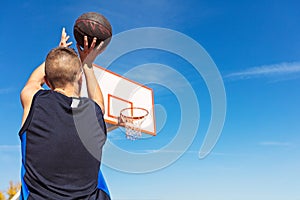 Young man shooting free throws from the foul line