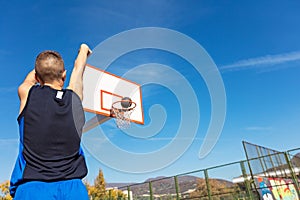 Young man shooting free throws from the foul line