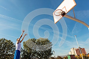 Young man shooting free throws from the foul line