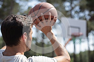 young man shooting free throws from foul line