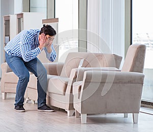 Young man shopping in furniture store