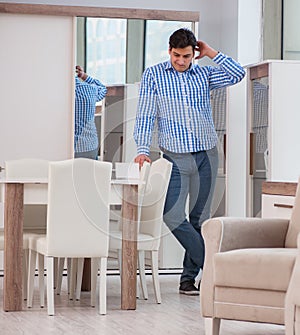 Young man shopping in furniture store