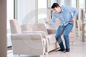 The young man shopping in furniture store