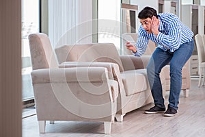 The young man shopping in furniture store