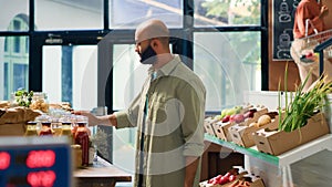 Young man shops at local supermarket