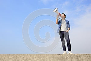 Young man shout megaphone