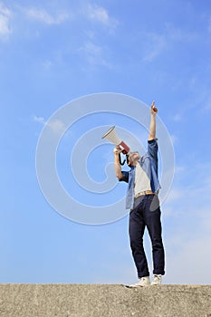 Young man shout megaphone