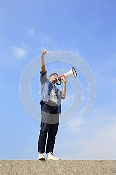 Young man shout megaphone